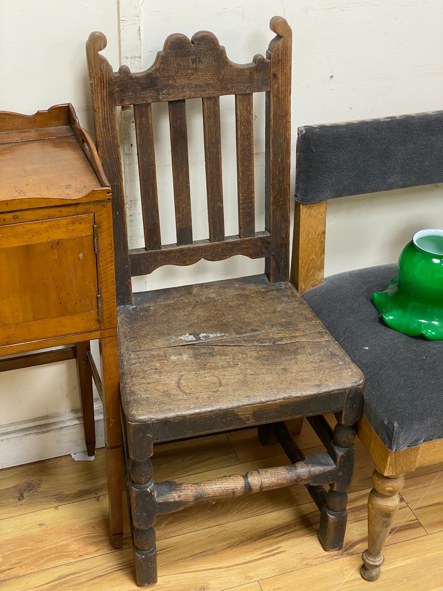 A near pair of 18th century wood seat chairs, larger width 45cm, height 101cm
